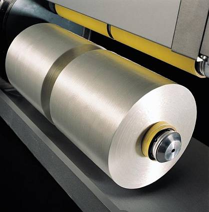 Precise package build up with winding heads for BCF and technical yarns Precise package build up with winding heads for BCF and technical yarns