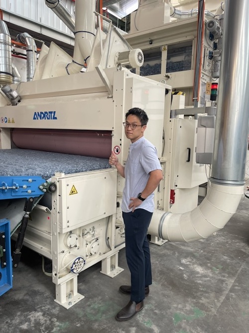 Mr. William Wong, Group Director of MENANG, at the restarted airlay production line © 2026 ANDRITZ 