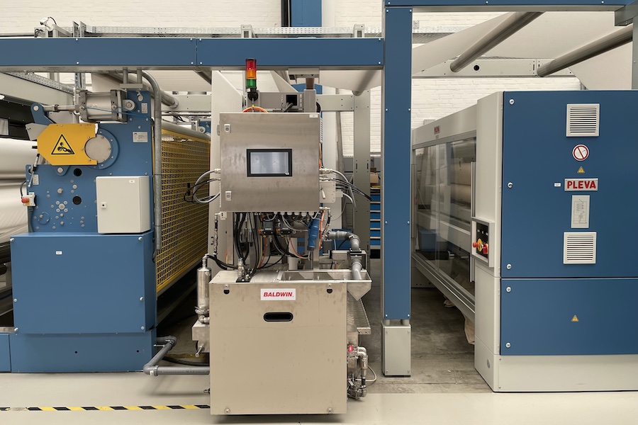The Baldwin TexCoat™ G4 spray unit integrated into a Montex stenter at the Monforts ATC in Germany. © 2025 Monforts The Baldwin TexCoat™ G4 spray unit integrated into a Montex stenter at the Monforts ATC in Germany. © 2025 Monforts