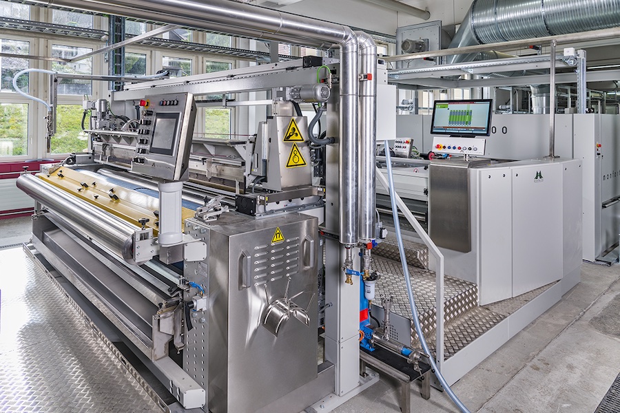 MontexCoat unit installed in front of a MONTEX stenter © 2026 Monforts