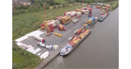 Caption: Sustainable container transport passing through the River Terminal Wielsbeke, B.I.G.’s global inland hub to the rest of the world. (Photo: © POM West-Vlaanderen)