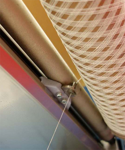 Production of a lampshade: Structure winding process. Photo: DITF Production of a lampshade: Structure winding process. Photo: DITF