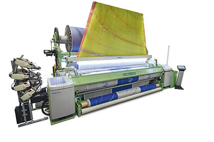 Optimum transitions from the pile to the border: The terry weaving machines from DORNIER deliver the highest precision and loop quality DORNIER Air-Jet Weaving Machine A1 ServoTerry, Type ATSF 8/J G with a nominal width of 340 cm
Artikel: Terry fabrics
(Image: „Terry weaving“; Source: DORNIER)
Optimum transitions from the pile to the border: The terry weaving machines from DORNIER deliver the highest precision and loop quality DORNIER Air-Jet Weaving Machine A1 ServoTerry, Type ATSF 8/J G with a nominal width of 340 cm
Artikel: Terry fabrics
(Image: „Terry weaving“; Source: DORNIER)
