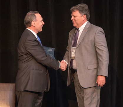 INDA President Dave Rousse congratulates Bryan Haynes (c) 2018 INDA INDA President Dave Rousse congratulates Bryan Haynes (c) 2018 INDA