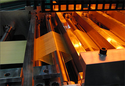 Aramid tapes during spreading (c) 2019 KARL MAYER
