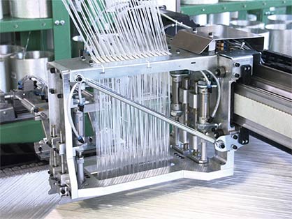 Production of a glass layer textile on the COP MAX 4 (c) 2018 KARL MAYER Production of a glass layer textile on the COP MAX 4 (c) 2018 KARL MAYER