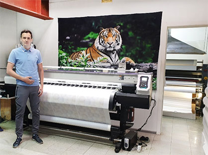 TOMDOM Founder, Vyacheslav Markov, with the Mimaki JV300-160 sublimation printer © Mimaki TOMDOM Founder, Vyacheslav Markov, with the Mimaki JV300-160 sublimation printer © Mimaki