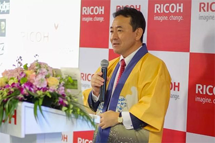 Tetsuya Morita, GM of Industrial Printing, announced that Digital Micro Factory, an important concept to the Group, and RAMP-UP the apparel consortium had officially launched. (c) 2019 Ricoh Tetsuya Morita, GM of Industrial Printing, announced that Digital Micro Factory, an important concept to the Group, and RAMP-UP the apparel consortium had officially launched. (c) 2019 Ricoh