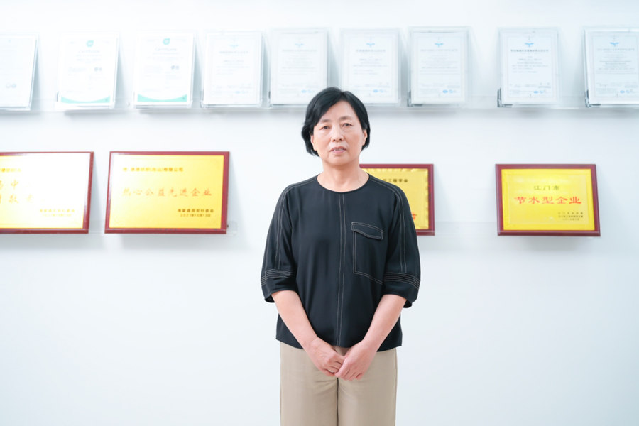 Ms. Wang Lihua, General Manager of JIEDE Textile, at the company’s premises, where numerous certificates and awards reflect its achievements. © 2026 Stäubli