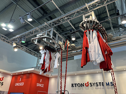 Eton Systems overhead garment automation demonstrated at the show. © 2023 Eton Systems
