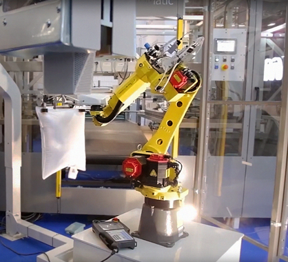Robotic pillow-making system from ACG Kinna Automatic. Robotic pillow-making system from ACG Kinna Automatic.